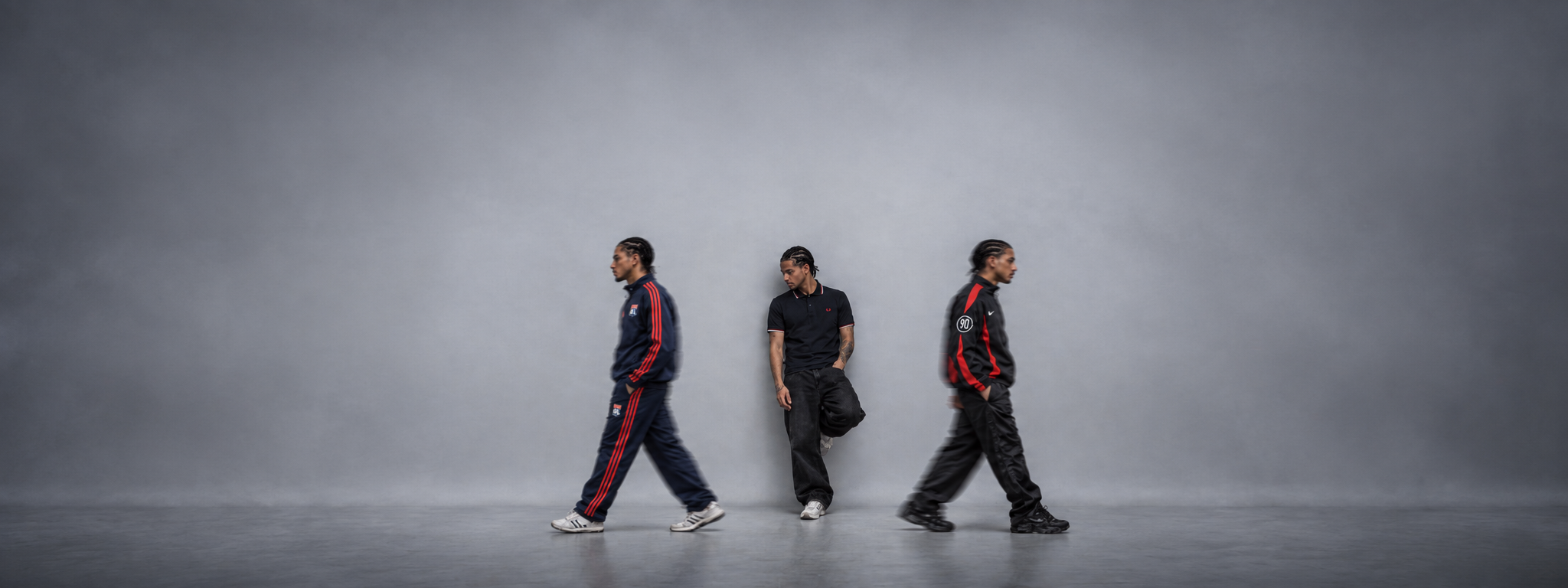 Drei Männer in Vintage Trainingsjacken und Tracksuits im Retro-Look